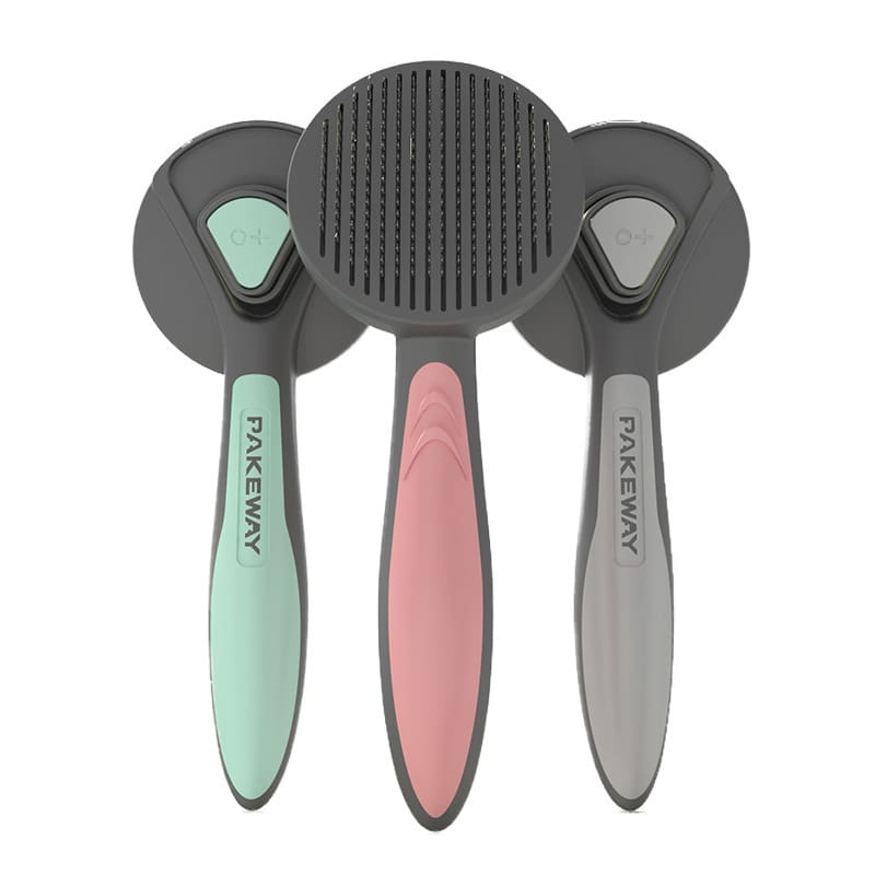 Three pet grooming brushes in different colors.