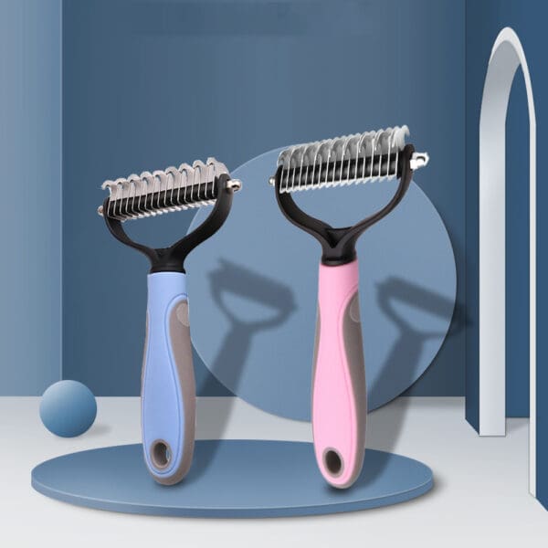 Two pet grooming combs, blue and pink.