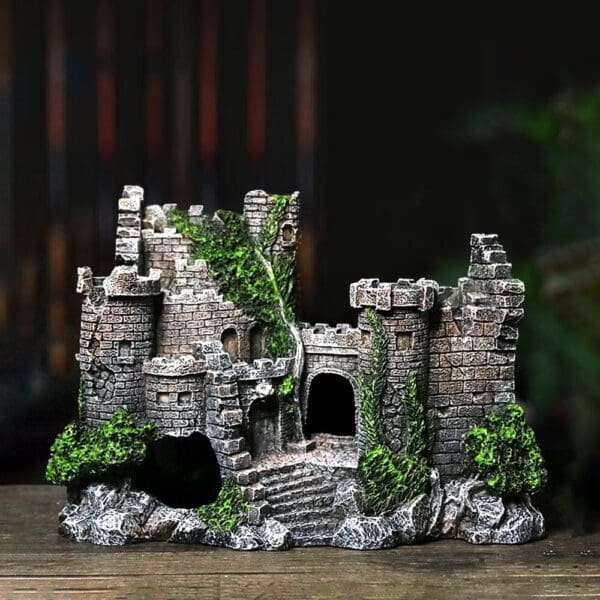 Stone castle aquarium ornament with greenery.