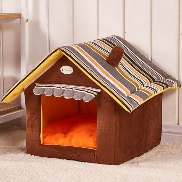 Brown and yellow striped dog house bed.