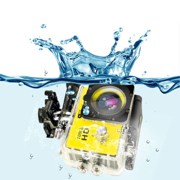 Yellow waterproof action camera underwater.