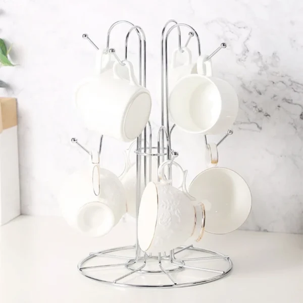 Metal cup rack with white mugs.