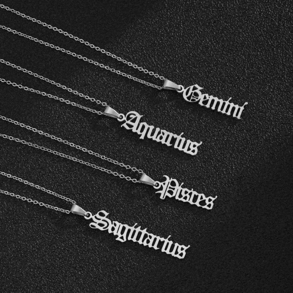 Zodiac sign necklaces on black background.