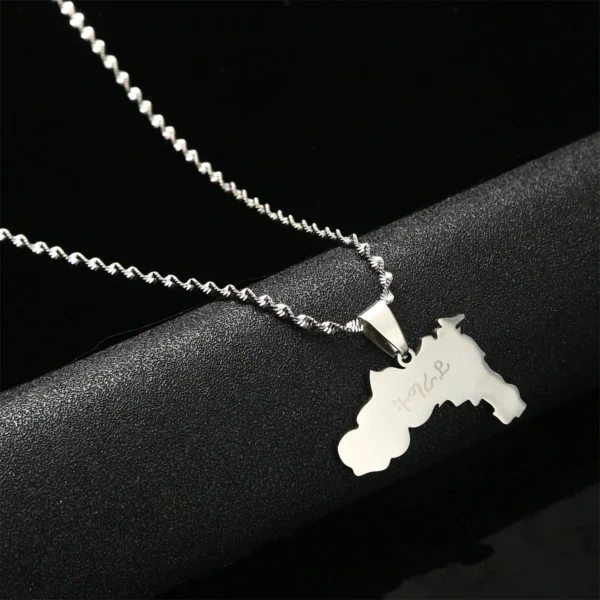 Silver necklace with a map pendant.