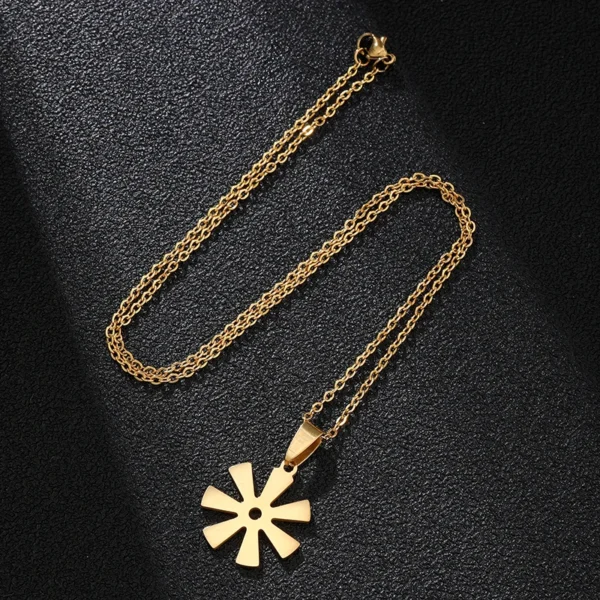 Gold chain necklace with star pendant.