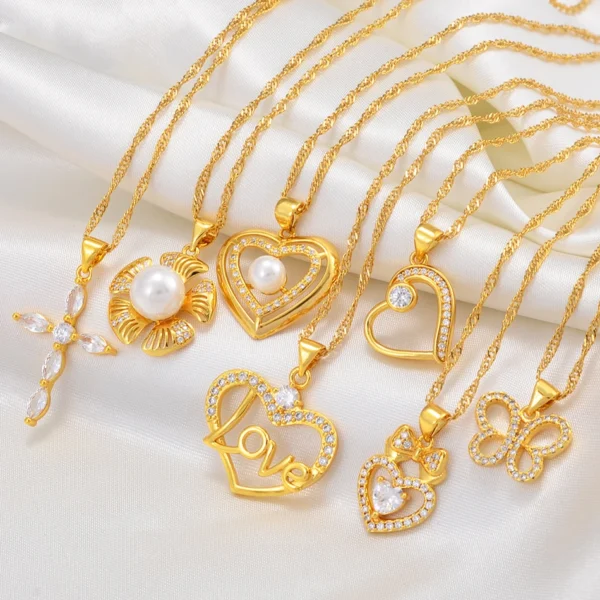 Gold necklaces with pearl and crystal pendants.