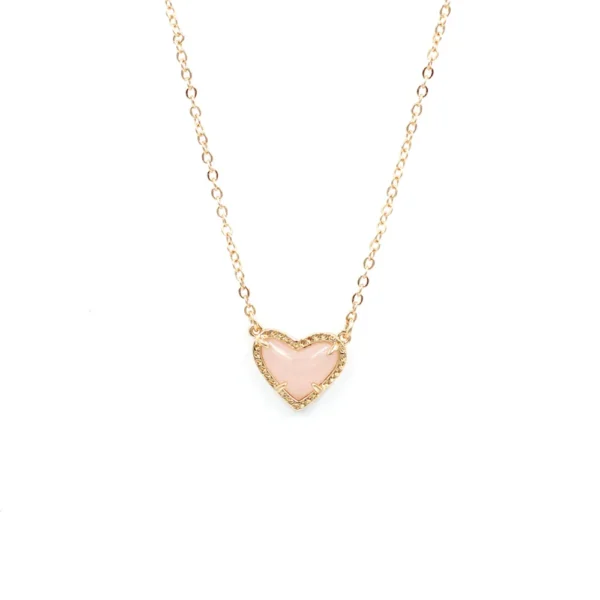 Gold chain with pink heart pendant.