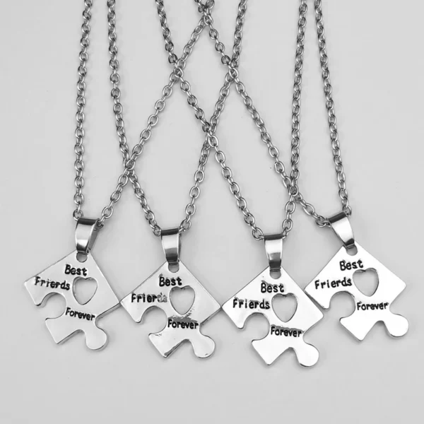 Four silver best friends forever puzzle necklaces.