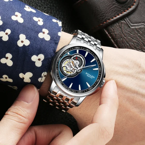 Silver and blue automatic wristwatch.