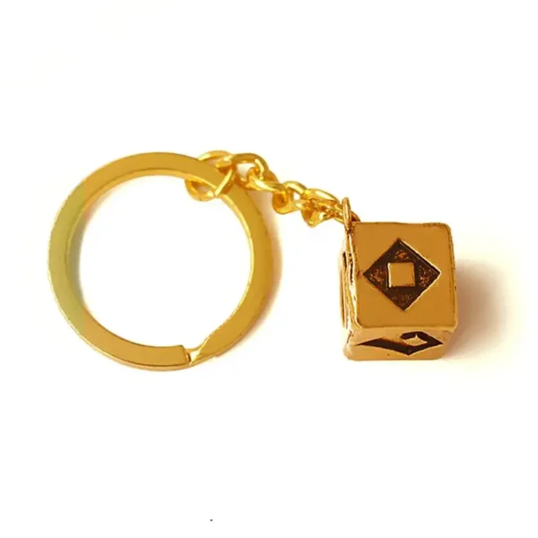 Gold keychain with a cube charm