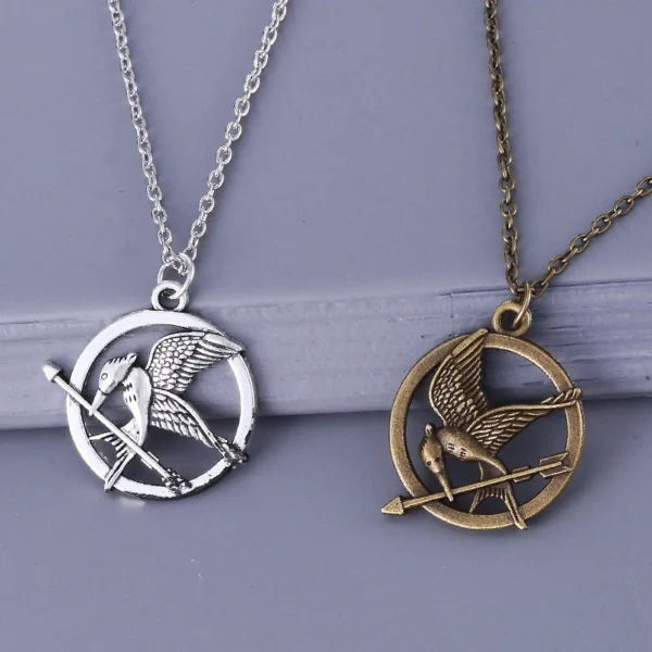 Mockingjay necklace in silver and bronze.