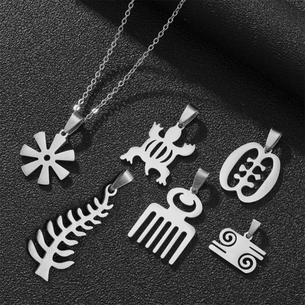 Silver Adinkra symbol pendants on a chain.