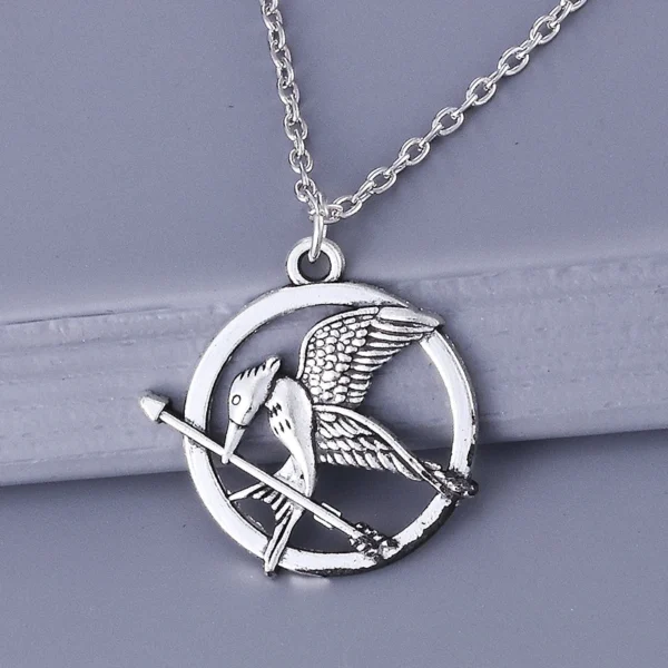 Silver Mockingjay necklace with arrow.