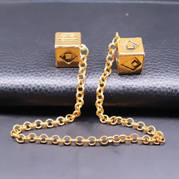 Gold chain with two dice charms.