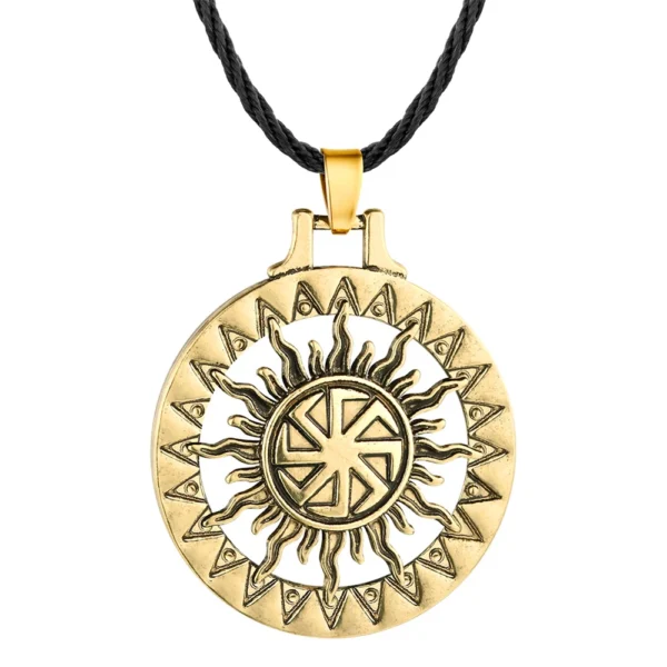 Gold sun symbol necklace with black cord.