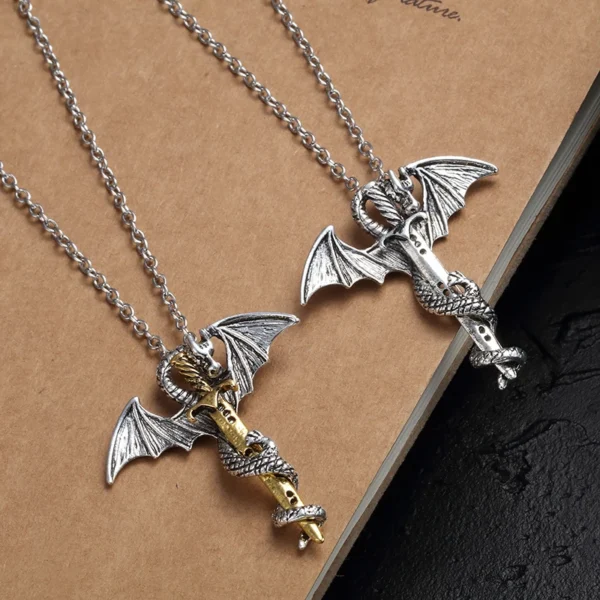 Two silver dragon sword necklaces.