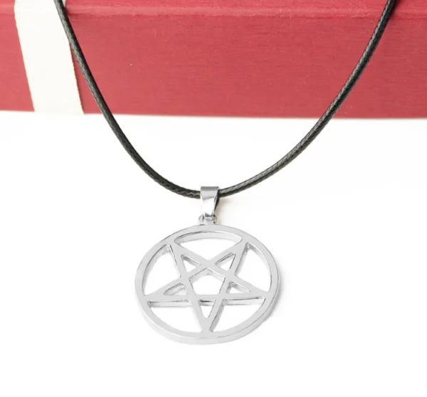 Silver pentagram pendant on black cord necklace.