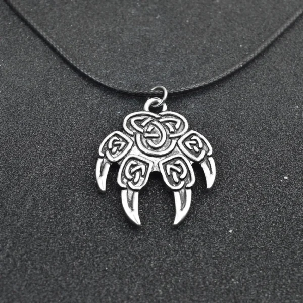 Silver Celtic knot bear paw pendant necklace.