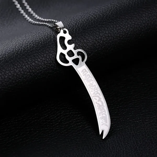 Silver sword pendant necklace with Arabic script.