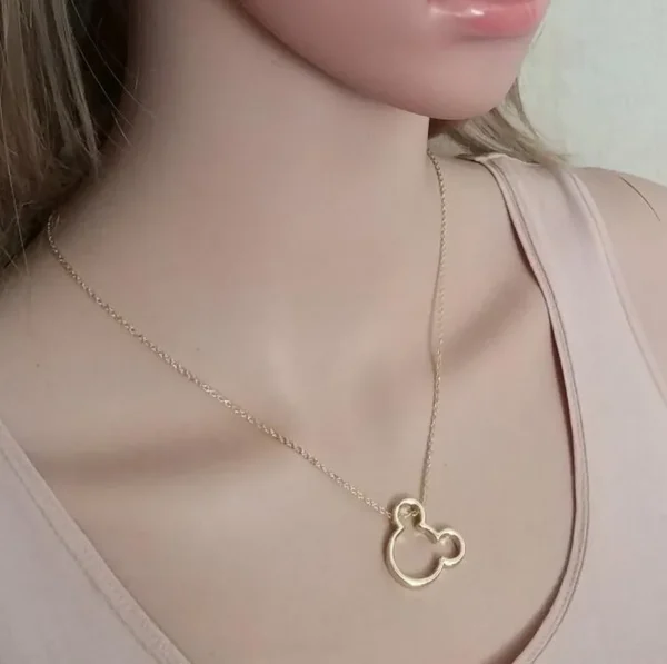 Gold chain with Mickey Mouse pendant.