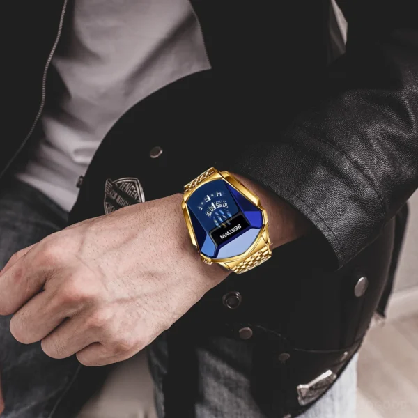 Man wearing a gold and blue watch.