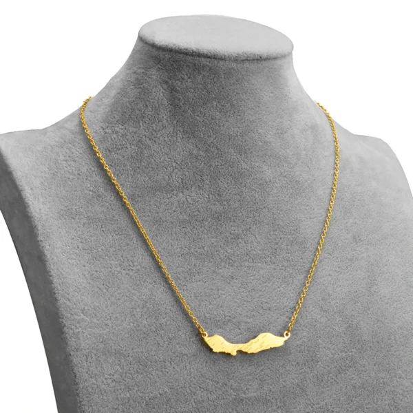 Gold necklace with island pendant.