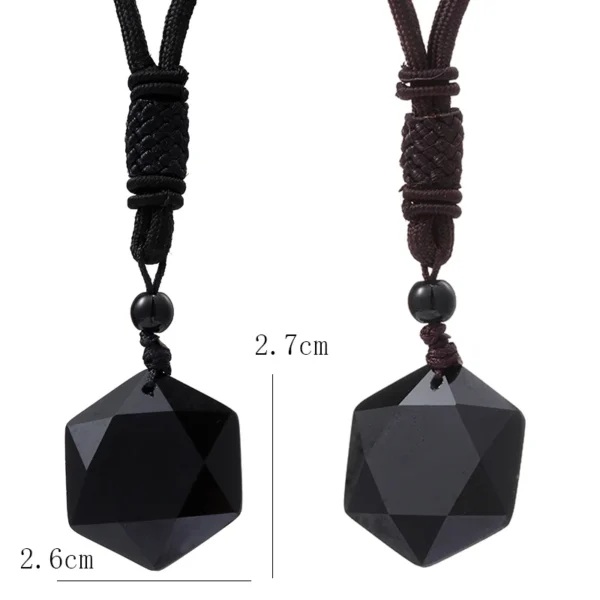 Two black gemstone necklaces with pendants.