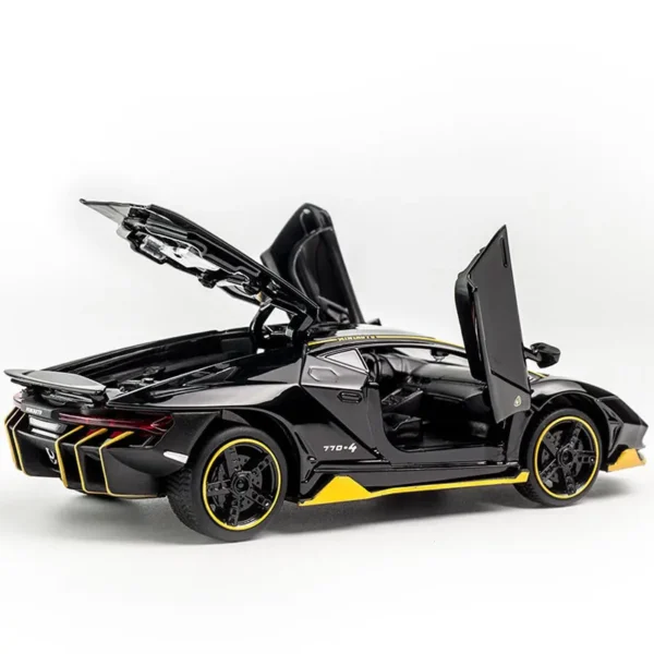 Black Lamborghini toy car with open doors.