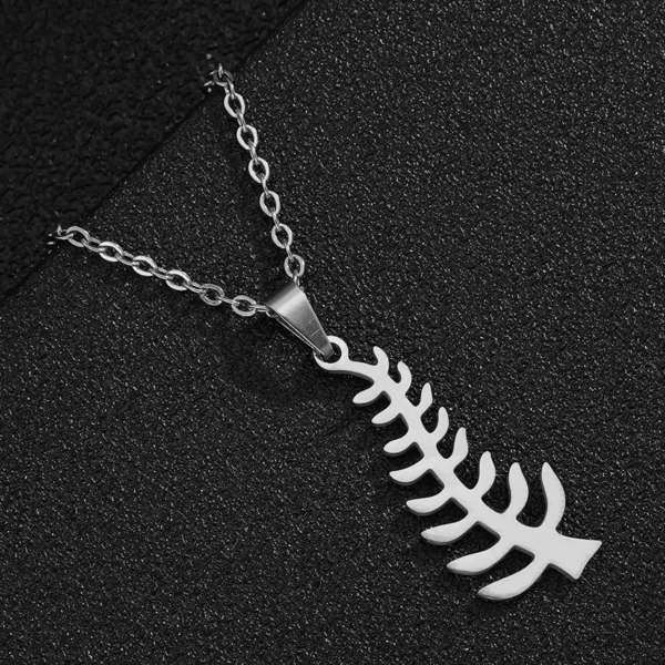 Silver chain necklace with fern pendant.