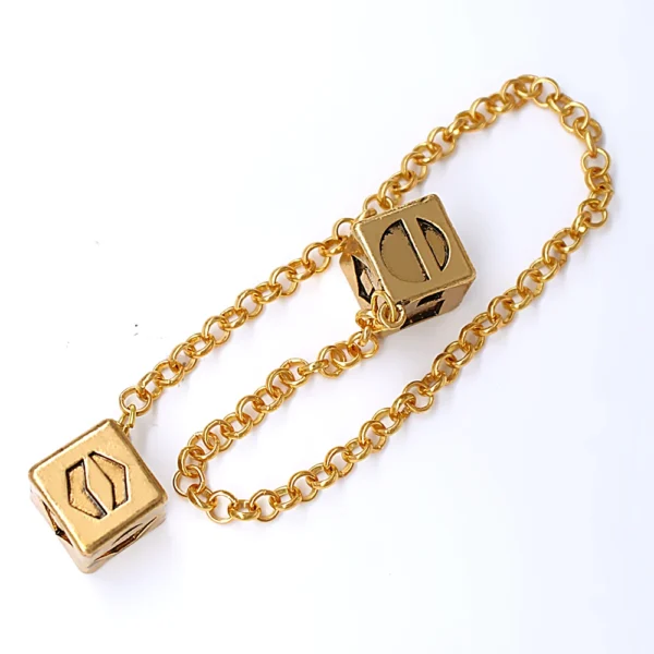 Gold chain with two dice charms.