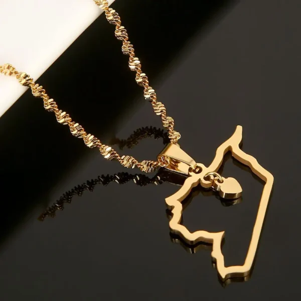 Gold necklace with heart and map pendant.