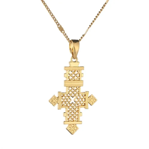 Gold chain with ornate cross pendant.