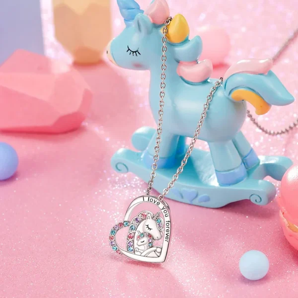 Silver necklace with unicorn heart pendant.