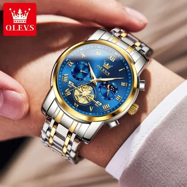 Gold and silver Olevs wristwatch with moon phase.