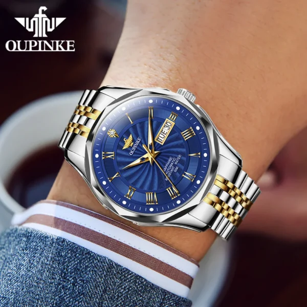 Gold and silver wristwatch with blue face.