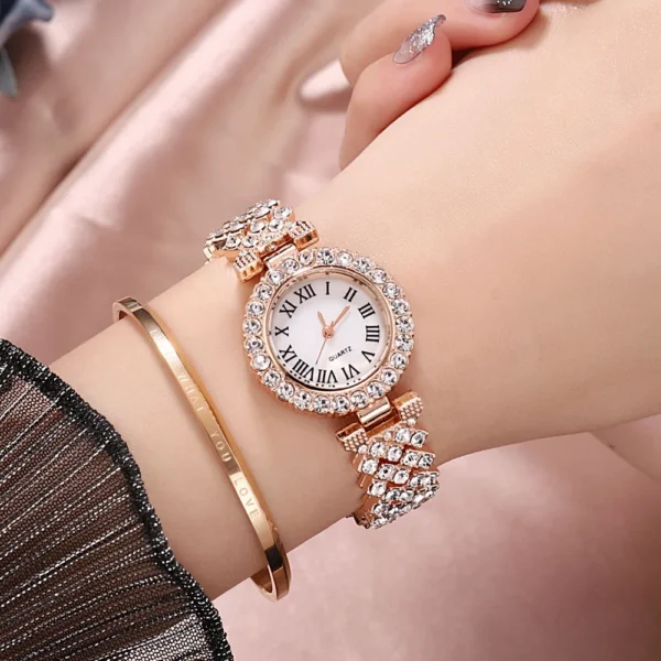 Diamond wristwatch with roman numerals.