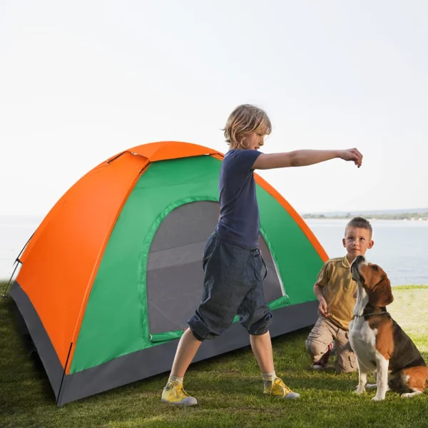 Orange and green camping tent with kids and dog.