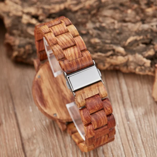 Wooden wristwatch with metal clasp.