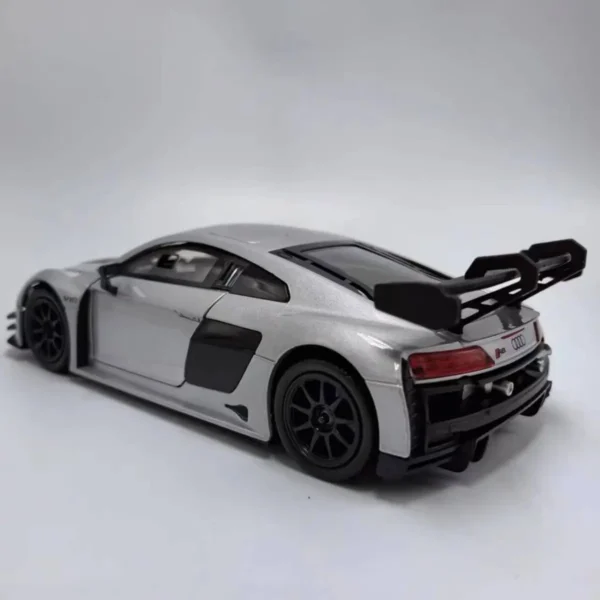 Silver Audi R8 model car with spoiler.