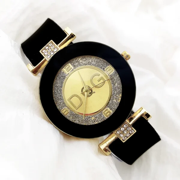 Black and gold wristwatch with DG logo.