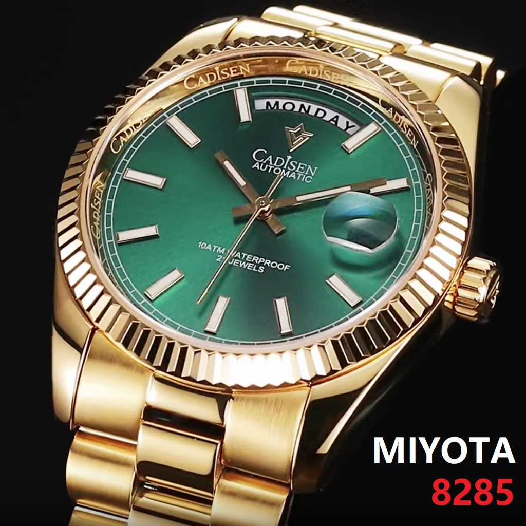 Gold automatic watch with green face.