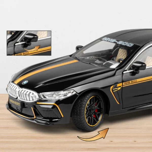 Black BMW model car with gold stripes.