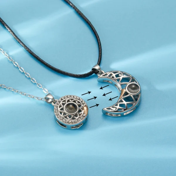 Two silver necklaces with moon and circle pendants.