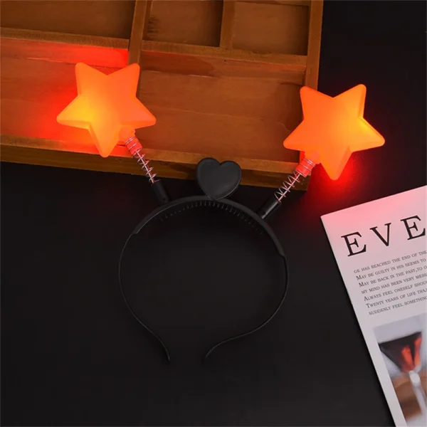 Black headband with two red star lights.