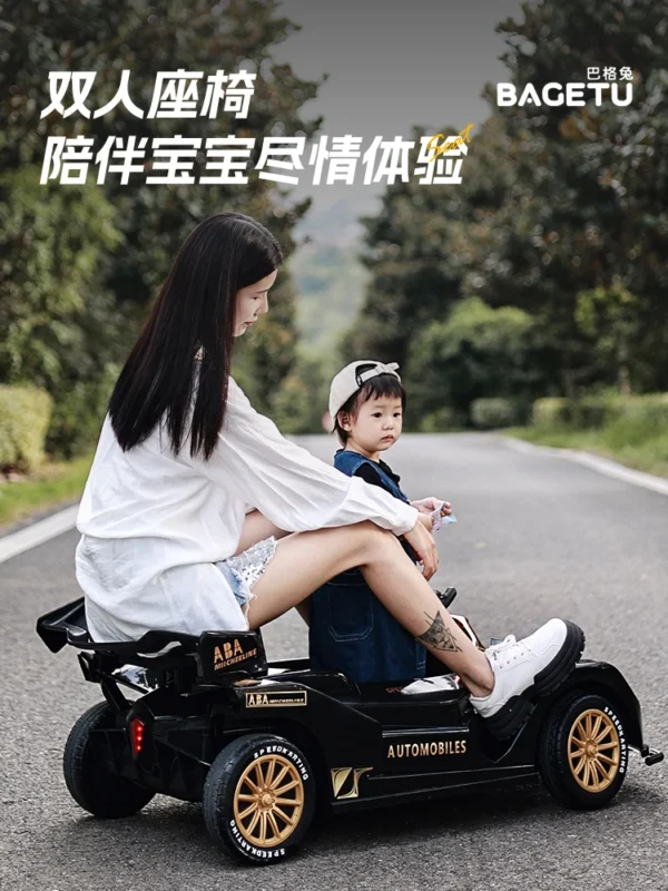 Woman and child riding black toy car.