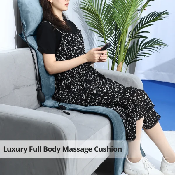 Woman relaxing with full body massage cushion.