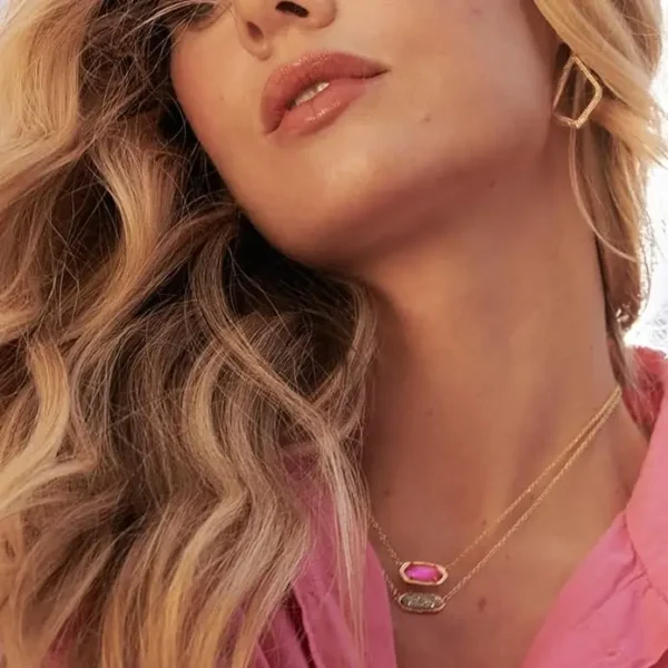 Woman with blonde hair wearing a necklace and earrings.