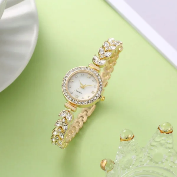 Gold watch with crystal leaf band.