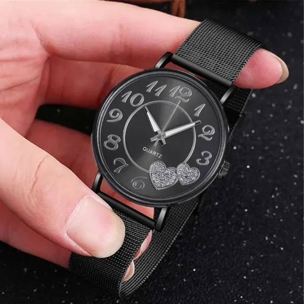 Black quartz watch with heart details.