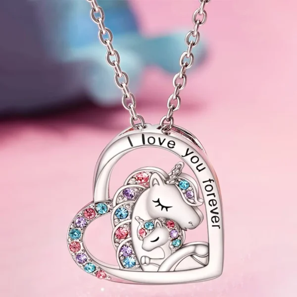 Silver unicorn heart necklace with crystals.